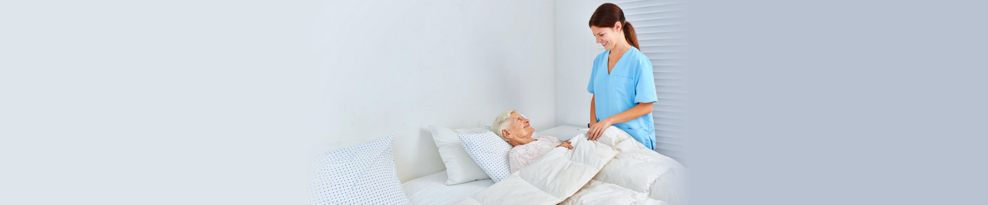 caregiver taking care of a senior woman